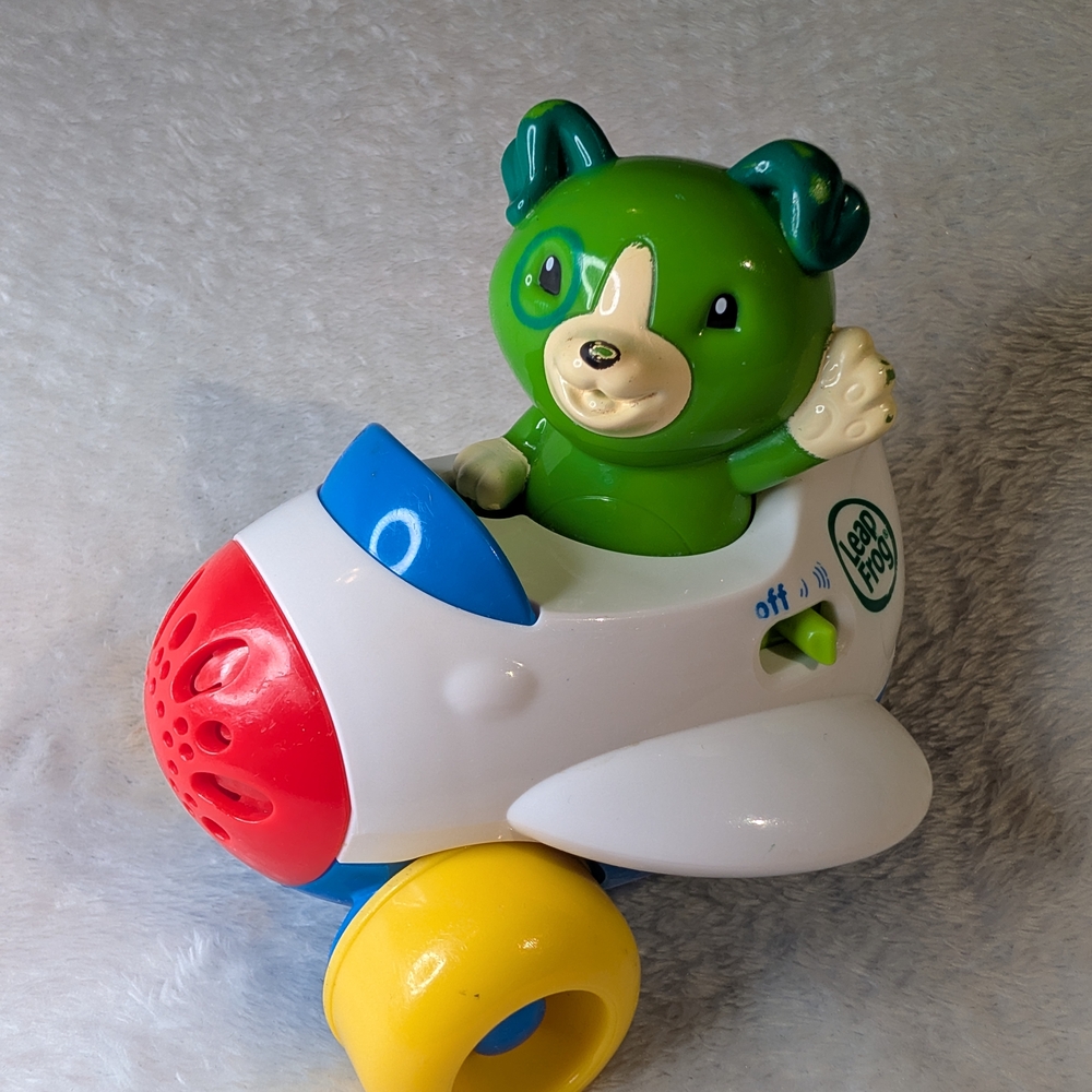 Green Puppy Plane Toy - Interactive Talking & Singing Alphabet Toy